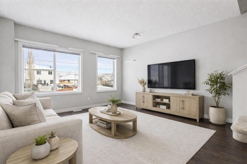 2506 Jumping Pound Common, Cochrane, AB - Indoor Photo Showing Living Room