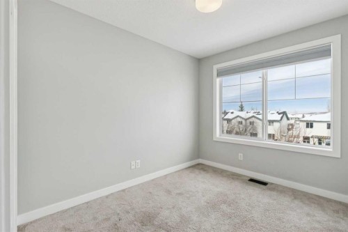 2506 Jumping Pound Common, Cochrane, AB - Indoor Photo Showing Other Room
