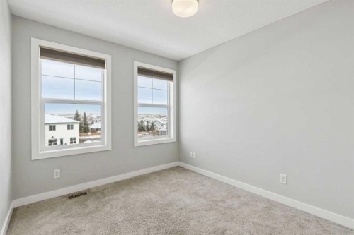 2506 Jumping Pound Common, Cochrane, AB - Indoor Photo Showing Other Room