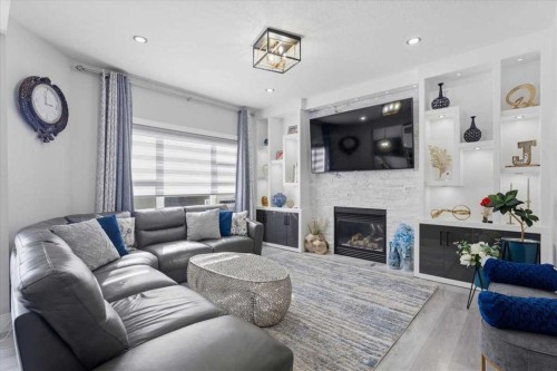73 Saddleland Close Ne, Calgary, AB - Indoor Photo Showing Living Room With Fireplace