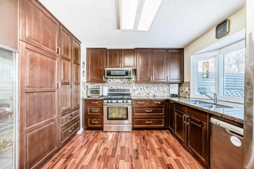 200 Edgemont Estates Drive Nw, Calgary, AB - Indoor Photo Showing Kitchen With Double Sink