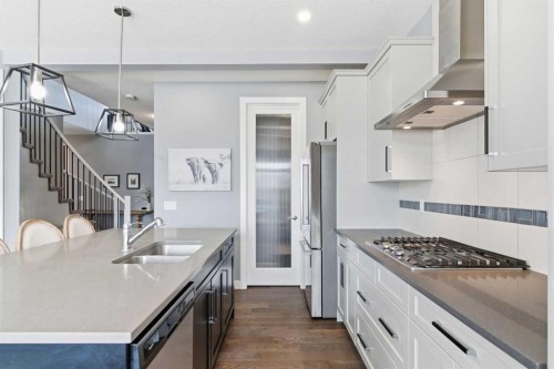 12 Ranchers Bay, Okotoks, AB - Indoor Photo Showing Kitchen With Double Sink With Upgraded Kitchen