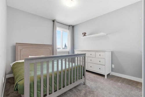 12 Ranchers Bay, Okotoks, AB - Indoor Photo Showing Bedroom