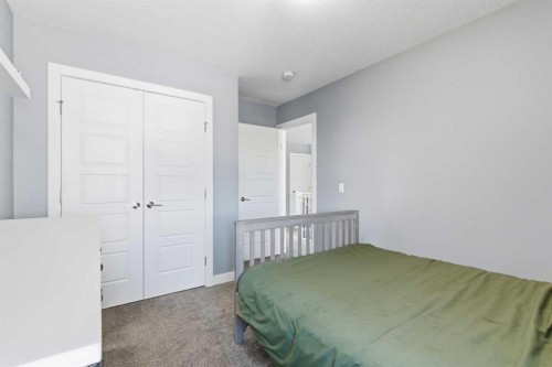 12 Ranchers Bay, Okotoks, AB - Indoor Photo Showing Bedroom