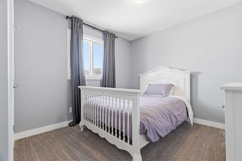 12 Ranchers Bay, Okotoks, AB - Indoor Photo Showing Bedroom