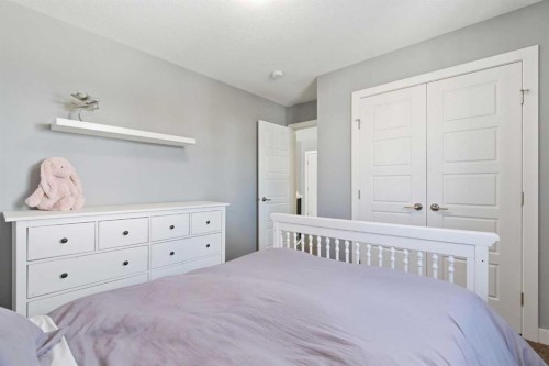12 Ranchers Bay, Okotoks, AB - Indoor Photo Showing Bedroom