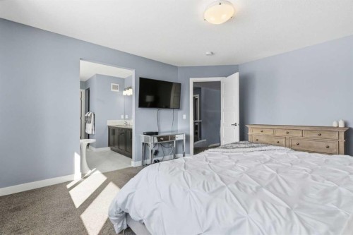 12 Ranchers Bay, Okotoks, AB - Indoor Photo Showing Bedroom