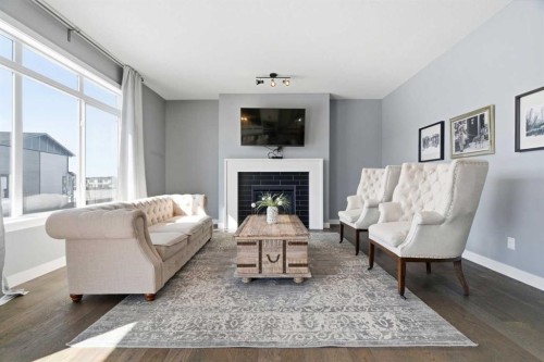 12 Ranchers Bay, Okotoks, AB - Indoor Photo Showing Living Room With Fireplace