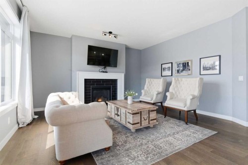 12 Ranchers Bay, Okotoks, AB - Indoor Photo Showing Living Room With Fireplace