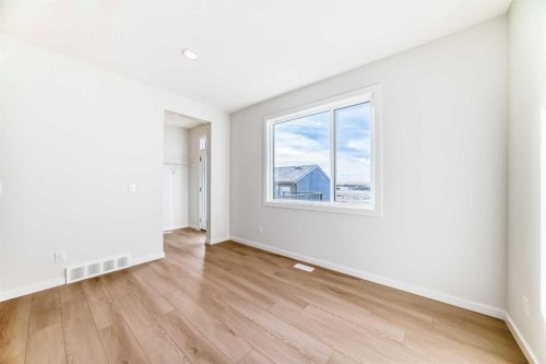 48 Creekside Rise Sw, Calgary, AB - Indoor Photo Showing Other Room