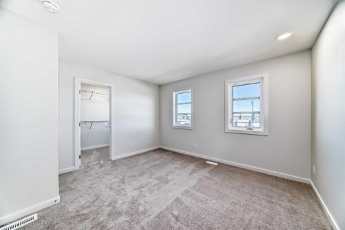 48 Creekside Rise Sw, Calgary, AB - Indoor Photo Showing Other Room