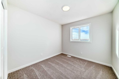 48 Creekside Rise Sw, Calgary, AB - Indoor Photo Showing Other Room