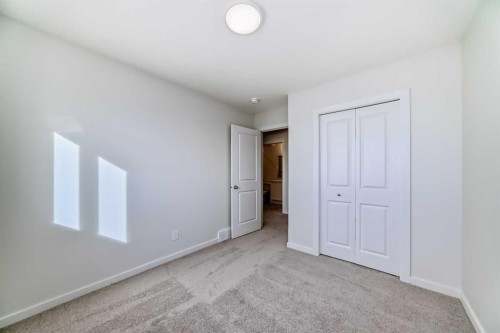 48 Creekside Rise Sw, Calgary, AB - Indoor Photo Showing Other Room