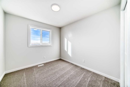 48 Creekside Rise Sw, Calgary, AB - Indoor Photo Showing Other Room