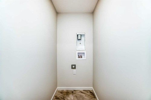 48 Creekside Rise Sw, Calgary, AB - Indoor Photo Showing Other Room