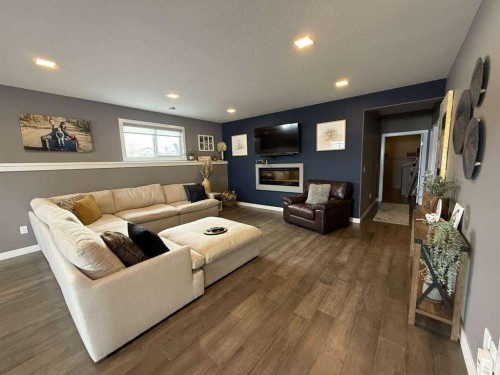 10522 101 Avenue, Sexsmith, AB - Indoor Photo Showing Living Room With Fireplace
