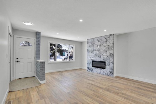 363 Templeside Circle Ne, Calgary, AB - Indoor Photo Showing Living Room With Fireplace