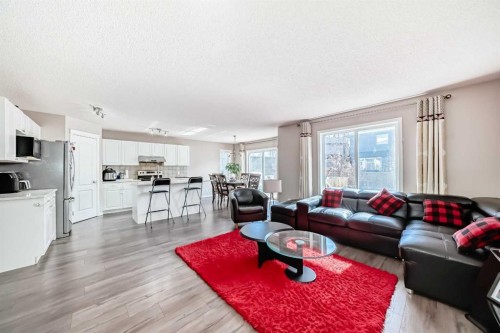 9 Somerside Crescent Sw, Calgary, AB - Indoor Photo Showing Living Room With Fireplace