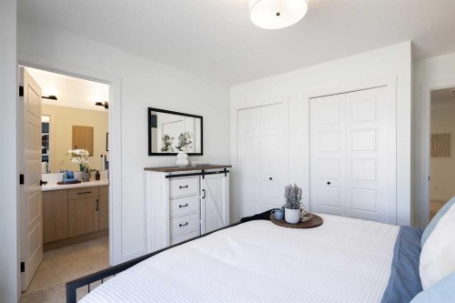 13 Wild Rose Way Se, Calgary, AB - Indoor Photo Showing Bedroom