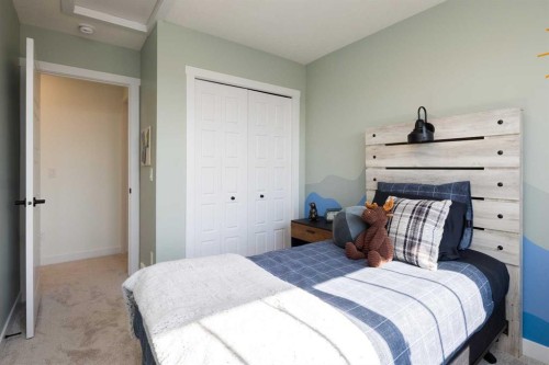 13 Wild Rose Way Se, Calgary, AB - Indoor Photo Showing Bedroom