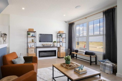 13 Wild Rose Way Se, Calgary, AB - Indoor Photo Showing Living Room With Fireplace