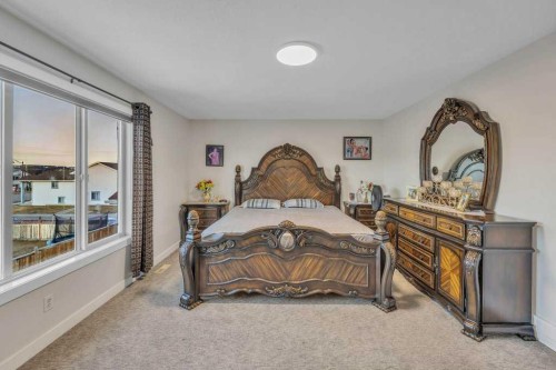 107 Taracove Landing Ne, Calgary, AB - Indoor Photo Showing Bedroom