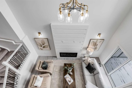 1917 Mccaskill Drive, Crossfield, AB - Indoor Photo Showing Other Room With Fireplace