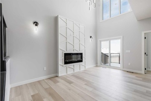 1955 Mccaskill Drive, Crossfield, AB - Indoor Photo Showing Living Room With Fireplace