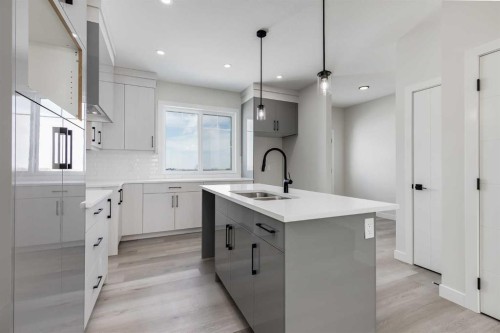 1989 Mccaskill Drive, Crossfield, AB - Indoor Photo Showing Kitchen With Double Sink With Upgraded Kitchen
