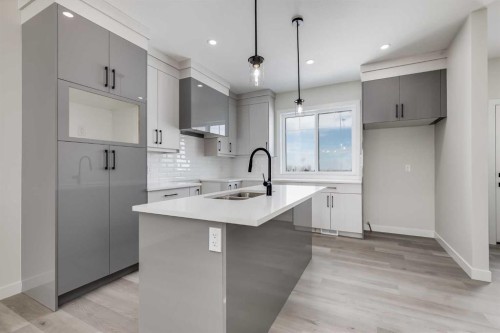 1989 Mccaskill Drive, Crossfield, AB - Indoor Photo Showing Kitchen With Double Sink With Upgraded Kitchen