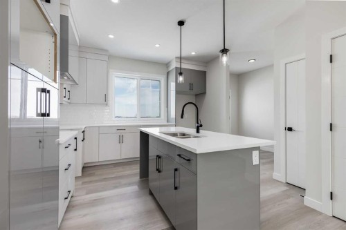 1989 Mccaskill Drive, Crossfield, AB - Indoor Photo Showing Kitchen With Double Sink With Upgraded Kitchen