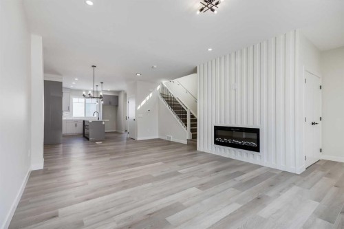 1989 Mccaskill Drive, Crossfield, AB - Indoor Photo Showing Living Room With Fireplace