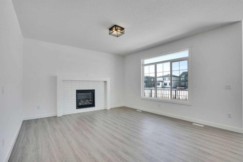 230 Kinniburgh Loop, Chestermere, AB - Indoor Photo Showing Living Room With Fireplace