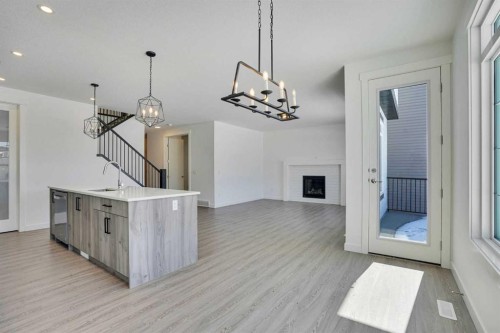 230 Kinniburgh Loop, Chestermere, AB - Indoor With Fireplace