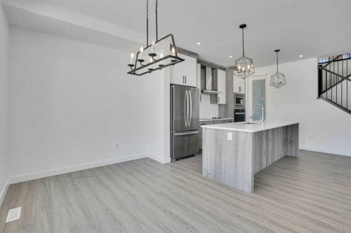 230 Kinniburgh Loop, Chestermere, AB - Indoor Photo Showing Kitchen With Upgraded Kitchen