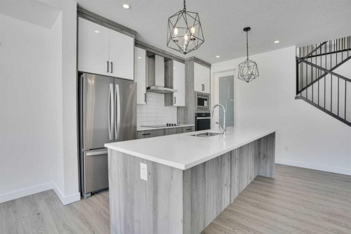 230 Kinniburgh Loop, Chestermere, AB - Indoor Photo Showing Kitchen With Upgraded Kitchen
