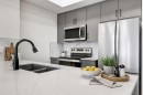 407-140 Mahogany Street, Calgary, AB  - Indoor Photo Showing Kitchen With Stainless Steel Kitchen With Double Sink With Upgraded Kitchen 