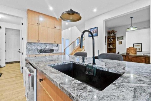 44 Ranchers Way, Okotoks, AB - Indoor Photo Showing Kitchen With Double Sink