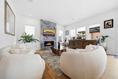 44 Ranchers Way, Okotoks, AB - Indoor Photo Showing Living Room With Fireplace