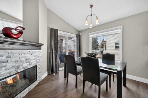 140 Citadel Park Nw, Calgary, AB - Indoor Photo Showing Dining Room With Fireplace