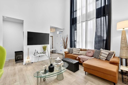 42 Heirloom Manor Se, Calgary, AB - Indoor Photo Showing Living Room With Fireplace