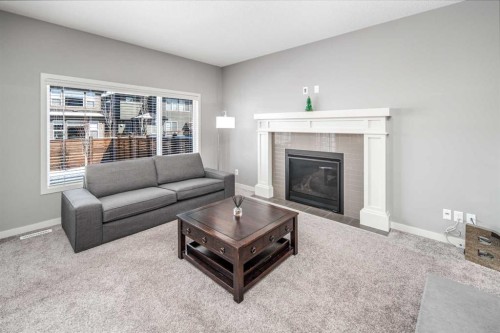 80 Howse Manor Ne, Calgary, AB - Indoor Photo Showing Living Room With Fireplace
