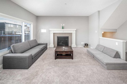 80 Howse Manor Ne, Calgary, AB - Indoor Photo Showing Living Room With Fireplace