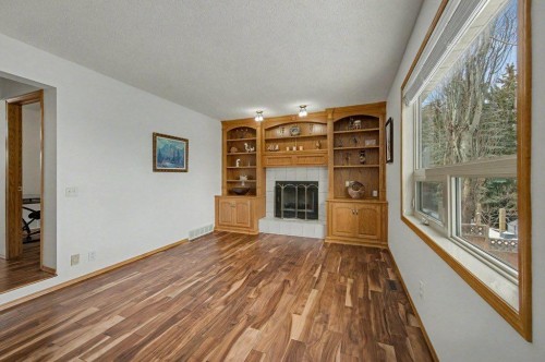 16 Straddock Crescent Sw, Calgary, AB - Indoor With Fireplace