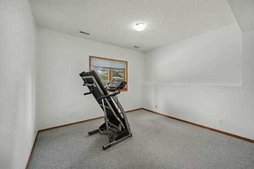 16 Straddock Crescent Sw, Calgary, AB - Indoor Photo Showing Gym Room