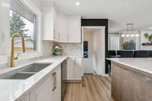 15 Brookmere Place Sw, Calgary, AB - Indoor Photo Showing Kitchen With Double Sink