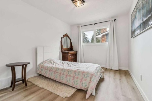 15 Brookmere Place Sw, Calgary, AB - Indoor Photo Showing Bedroom