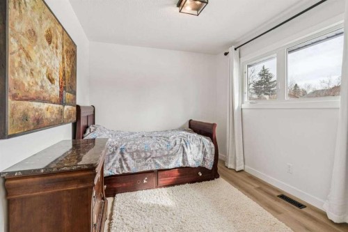 15 Brookmere Place Sw, Calgary, AB - Indoor Photo Showing Bedroom