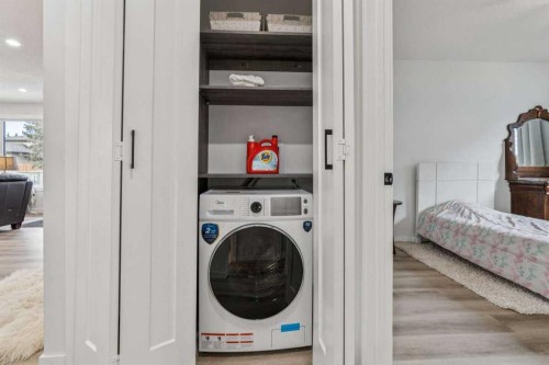 15 Brookmere Place Sw, Calgary, AB - Indoor Photo Showing Laundry Room