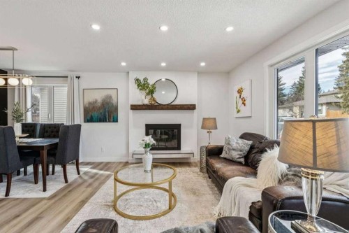 15 Brookmere Place Sw, Calgary, AB - Indoor With Fireplace
